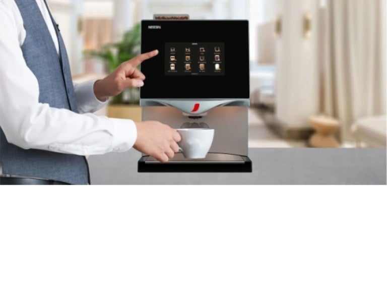 Person selecting coffee on a Nescafé machine